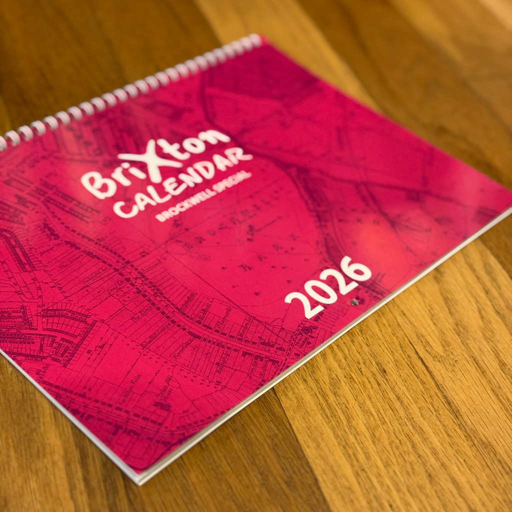 COVER2 Brixton Calendar front cover on a wooden floor